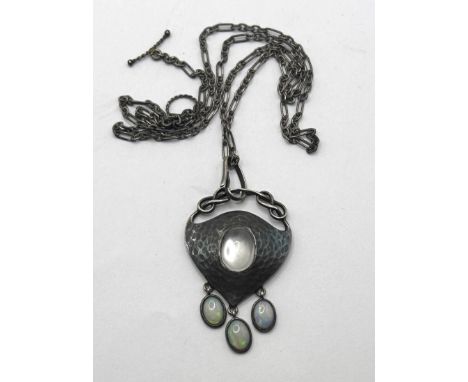 An Art Nouveau pewter and oval moonstone pendant, on a chain, with a receipt from Didier Antiques, dated 1998pendant: 4 cm x 