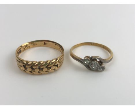 An 18ct gold ring, ring size R, 4 g, and a two stone diamond ring, ring size M (2)Two stone ring, one of the stones has been 