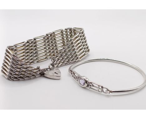 A silver bracelet, with a heart shaped padlock clasp, and a silver and purple stone bangle (2) 