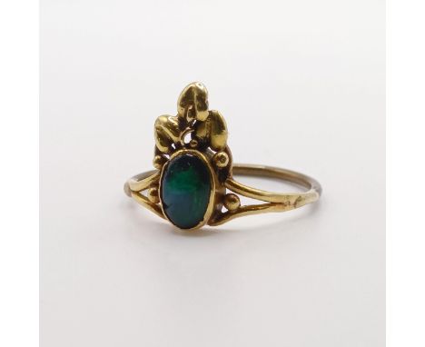 An Arts and Crafts yellow coloured metal and opal ring, by Jean Bassett, size J 1/2 Provenance:  Descent through the family 