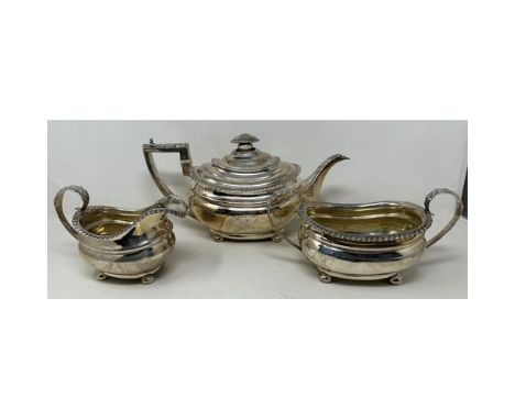 An early 19th century silver three piece tea service, marks rubbed, 34.6 ozt (3) Ivory Exemption registration 7MKE1H1H 