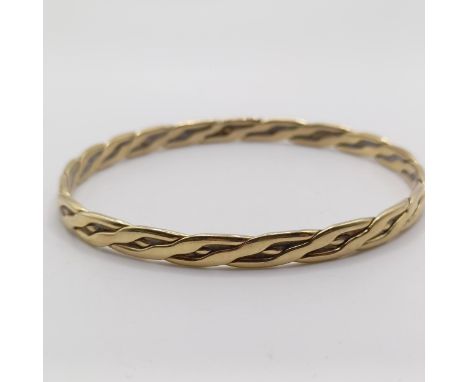 A 9ct gold bangle, 19.3 gInternal diameter approx. 7.5 cm 