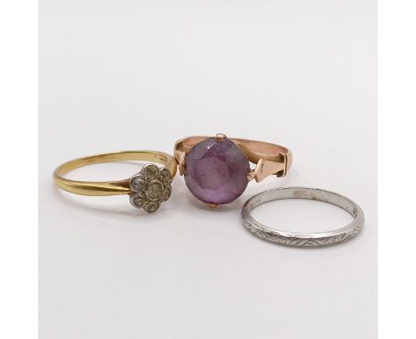 A purple stone dress ring (ring size O), a platinum wedding band (ring size K), 1.8 g, and a dress ring (ring size O) (3) 