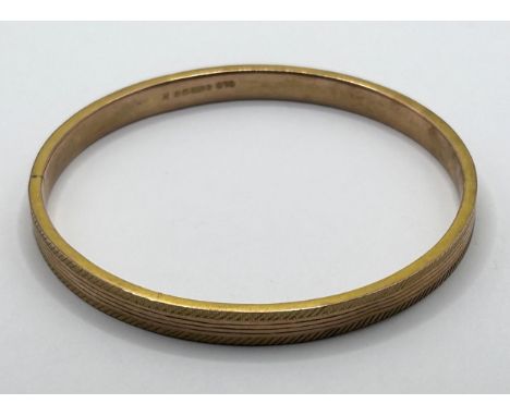 A 9ct gold bangle, 9.4 g 