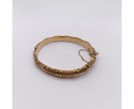 A 9ct gold faux bamboo hinged bangle, 12 g 