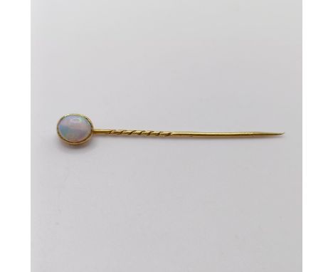 An opal stick pin 