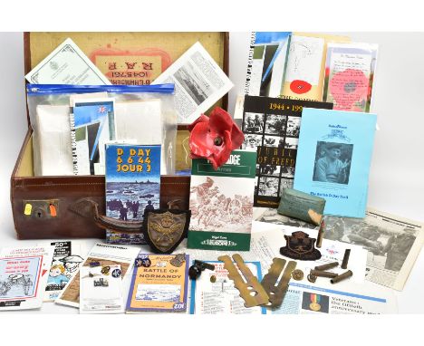 MEDIUM SUITCASE IN LEATHER, containing a large number of booklets, pamphlets, photos maps etc  in relation to D Day and the b