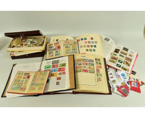 A RANGE OF FIRST DAY COVERS AND WORLDWIDE STAMPS,  across a number of albums and loose in tins, the albums include a sparsely