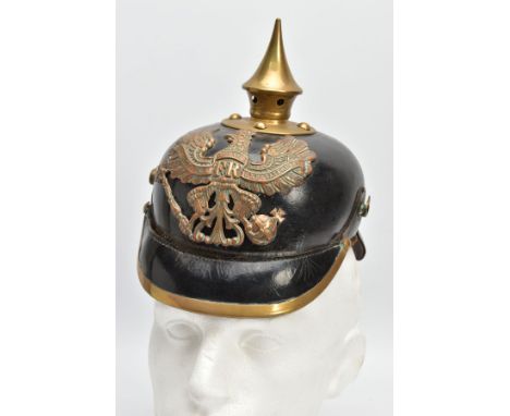 A FIRST WORLD WAR IMPERIAL GERMAN PICKELHAUBE HELMET, Leather and brass design, officially marked to rear neck guard 16IR 70R