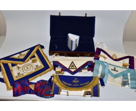 MASONIC INTEREST, a leather case containing five Masonic aprons, a Masonic sash and book of  Constitutions of the Antient Fra