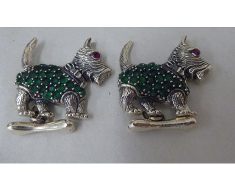 A pair of Sterling silver Scottie dog, chain link cufflinks with emerald coats and ruby set eyes 