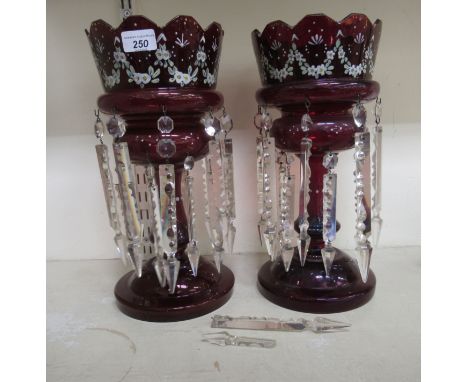 A pair of late Victorian ruby glass lustres, each with a castellated rims and clear glass pendants&nbsp; 14.5"h 
