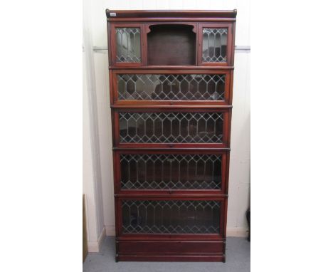 A mid 20thC Globe Wernicke mahogany bookcase, comprising five graduated tiers with lead glazed panelled doors, the uppermost 