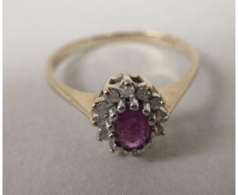 A 9ct gold claw set ruby and diamond cluster ring 