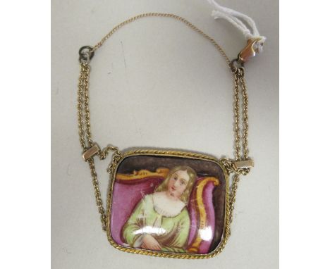 A yellow metal framed pendant, set with a pictorial ceramic tablet, on a fine neckchain 