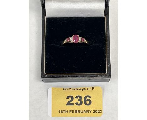 A 9ct ruby and diamond ring. 1.7g gross. Size P
