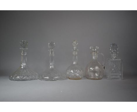 A Collection of Two Ships Decanters, One Spirit Decanter, Claret Jug and Globe and Stalk Decanter 