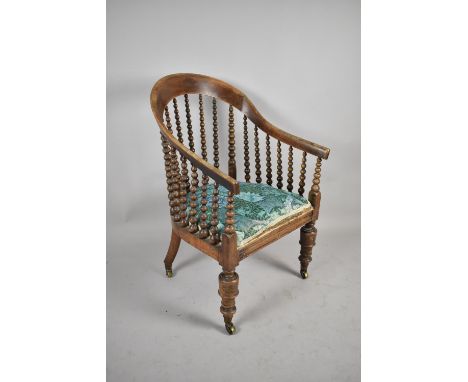 A Late 19th/Early 20th Century Gents Armchair with Bobbin Supports 