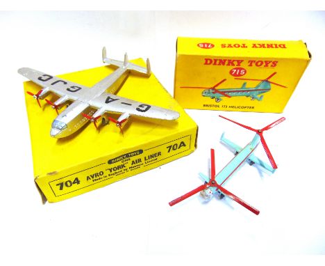 TWO DINKY MODEL AIRCRAFT  comprising a No.715, Bristol 173 Helicopter, G-AUXR, pale blue with red rotor blades and fuselage s