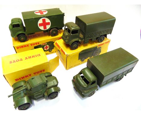 FOUR DINKY MODEL MILITARY VEHICLES  comprising a No.626, Ford Military Ambulance, olive drab with matching grooved hubs, exce