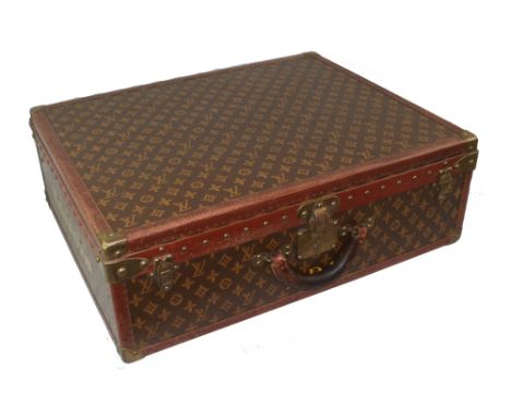 Louis Vuitton - a vintage suitcase, lacking interior trays, internal 70 Champs Elysees trade sticker, monogrammed D.D.H. and 