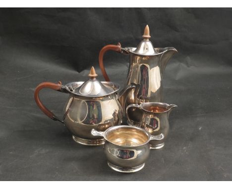 An Adie Bros Ltd four piece silver tea set, comprising of teapot, water jug, sucret and milk jug, Birmingham 1961 