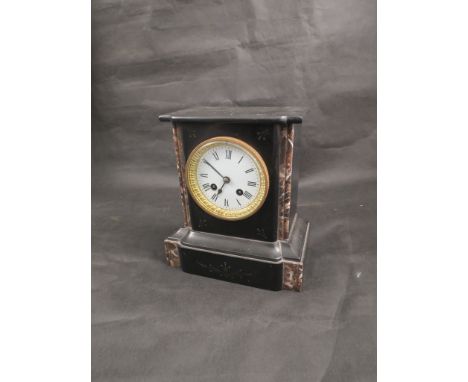 A late 19th Century mantel clock with white enamel face, black Roman numerals gilt bevel