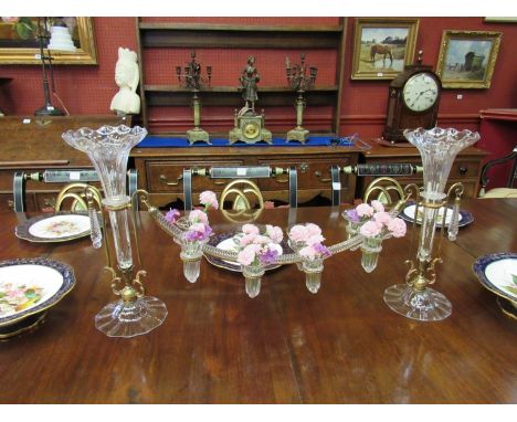 A Victorian glass and ormolu epergne two glass fluted vases joined together by a glass and ormolu swinging cradle, holding ei
