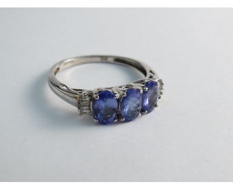 A 9ct gold tanzanite and diamond ring 