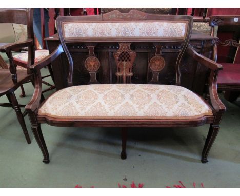 A late Victorian inlaid mahogany two seater sofa the pierced splats and scroll arms over a bow front seat on cabriole legs 