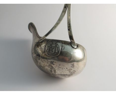 A 19th Century Dutch silver toddy ladle with ornately carved ivory handle, the bowl engraved with decoration, applied with a 