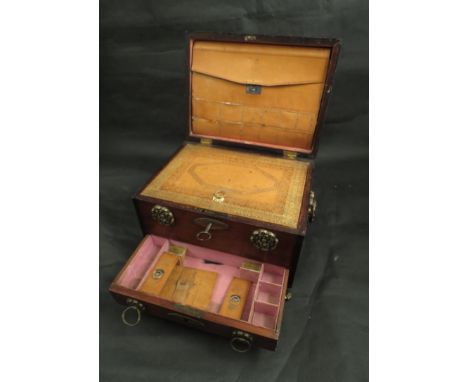 A late Georgian/early Victorian mahogany writing box with tooled leather interior, compartmental drawers, ring turned handles