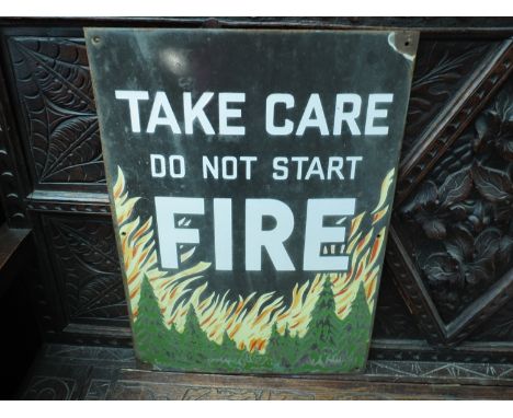 A vintage Forestry Commission enamel sign "TAKE CARE DO NOT START FIRE", bright scene of Woodland in flames, white text 
