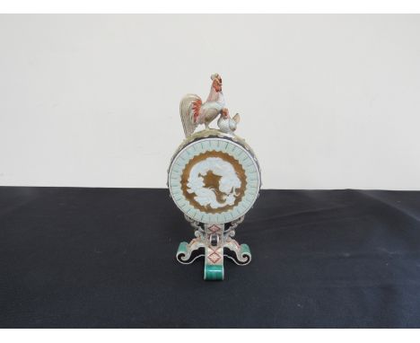 An early 20th Century moon flask vase with dragon design, surmounted by hen and cock, a/f