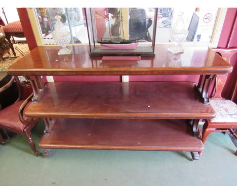 A large Victorian mahogany three-tier buffet with Gothic scroll supports between the shelves.  Approx, 165cm long x 105cm tal