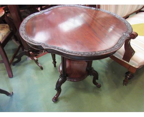 A circa 1840 a flame mahogany lamp table with dish shaped top and carved borders over turned cluster tri-columns on acanthus 