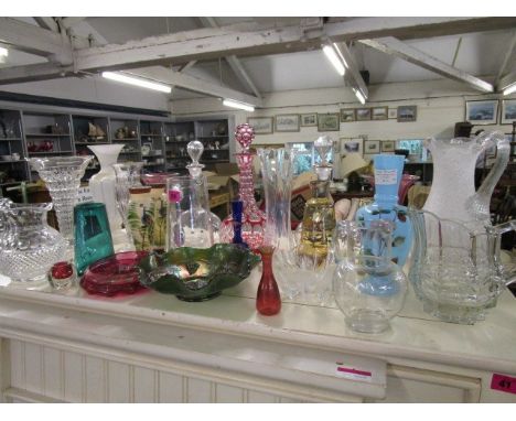 A selection of glassware to include a ruby overlaid and cut shelf and globe decanter and stopper