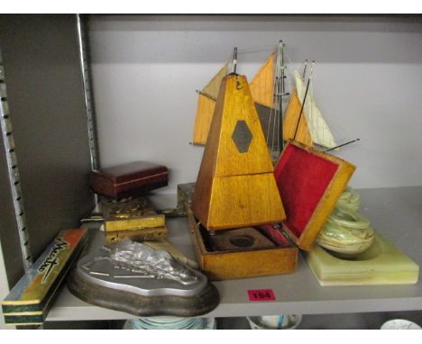 A mixed lot to include a metronome, a Mauchline ware box, a model of a boat and other items
