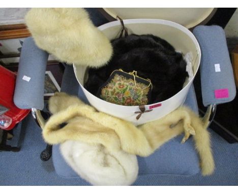 A collection of vintage fur hats, gloves, a silver plated button hook and a vintage evening bag