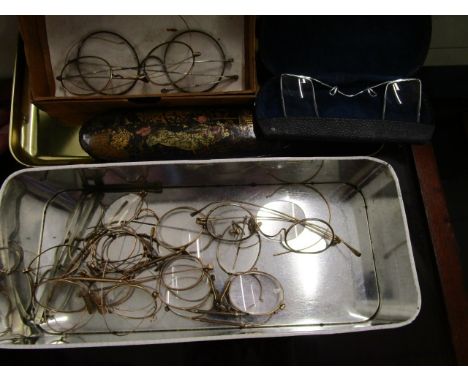 A box of assorted 19th century and vintage spectacles