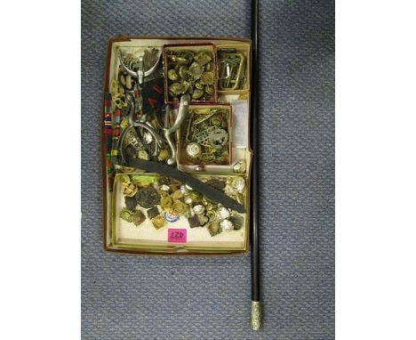 A Royal Irish Constabulary swagger stick and a mixed selection of military cap badges, buttons, ribbon bars and two pairs of 