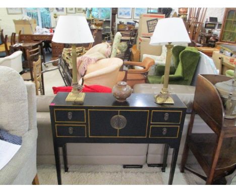 A black lacquered, oriental style console table, 33 x 395 x 10, together with a pair of gilt table lamps