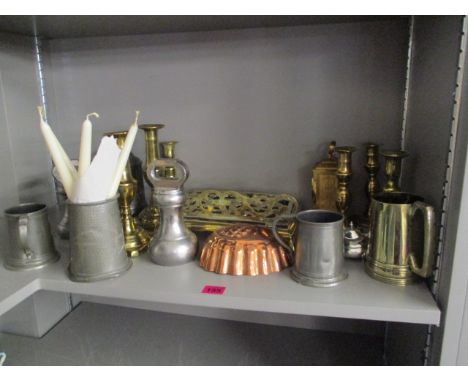 Mixed metal ware to include 19th century brass candlesticks, pewter tankards, a book stand, jelly moulds, a Swiss carriage cl