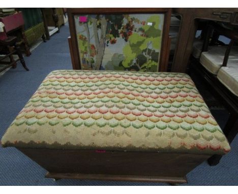 A Victorian/Edwardian mahogany ottoman with embroidered and upholstered lid, along with a mahogany fire screen with tapestry 