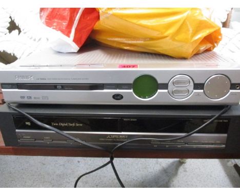 a Mitsubishi VHS recorder, a Philips LX7000 SA DVD/Digital surround system with remote, scart leads, speakers and microphone