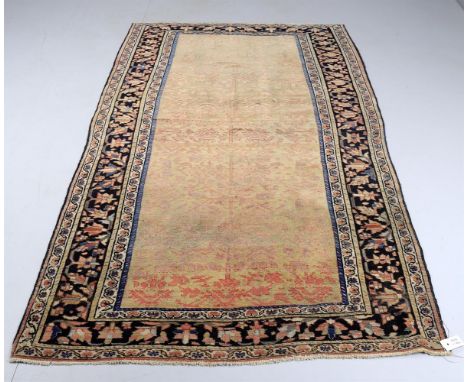 
	
		A Persian wool rug, approximately 199 x 120cm 
		
		Condition Report: 
		Central colours very faded- possibly folded to 