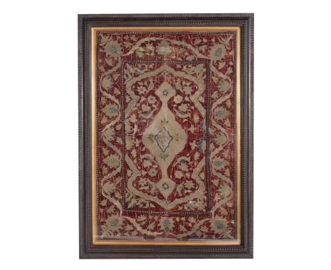 
	
		An embroidered velvet panel, 18th or 19th century, possibly worked for the Turkish market, the red velvet woven with gol