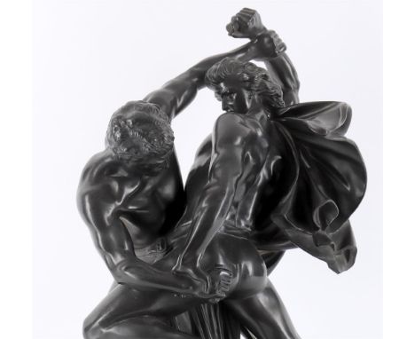 
	
		An early 20th century Danish black glazed basalt figural group of two warriors in combat, stamped marks for P. Ipsen/ Kj