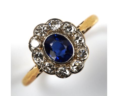 A sapphire and diamond oval cluster ring, unmarked gold settings with oval mixed-cut sapphire and old European-cut diamonds, 