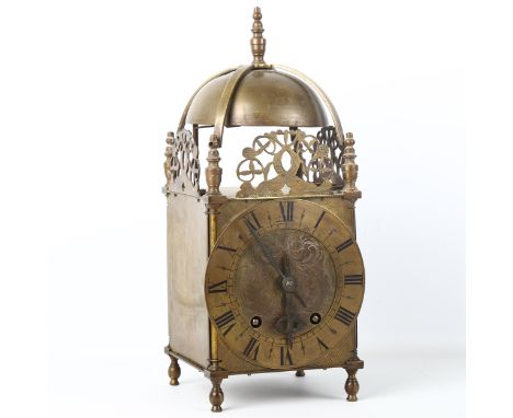 A large brass lantern clock, engraved Roman numeral chapter ring with English movement, back plate no. 946, case height 33cm,